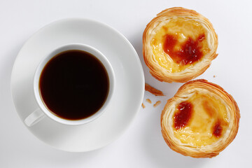 Egg tart with cup of coffee