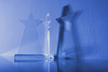 crystal trophy against blue background