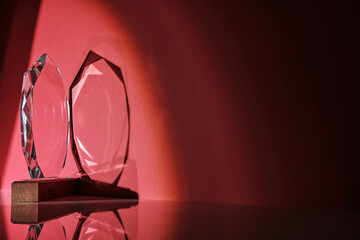 crystal trophy against red background