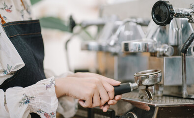 Opening a small business, AHappy Asian woman in an apron standing near a bar counter coffee shop, Small business owner, restaurant, barista, cafe, Online, SME, entrepreneur, and seller concept