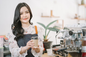 Opening a small business, AHappy Asian woman in an apron standing near a bar counter coffee shop, Small business owner, restaurant, barista, cafe, Online, SME, entrepreneur, and seller concept