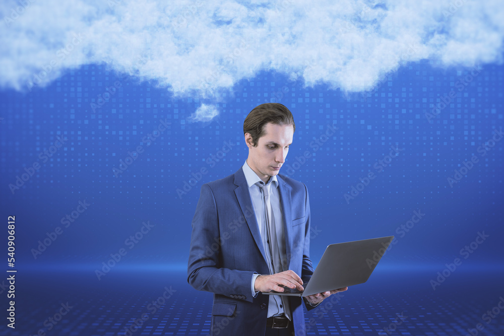 Poster attractive young european businessman with laptop standing on blurry digital blue background with ab