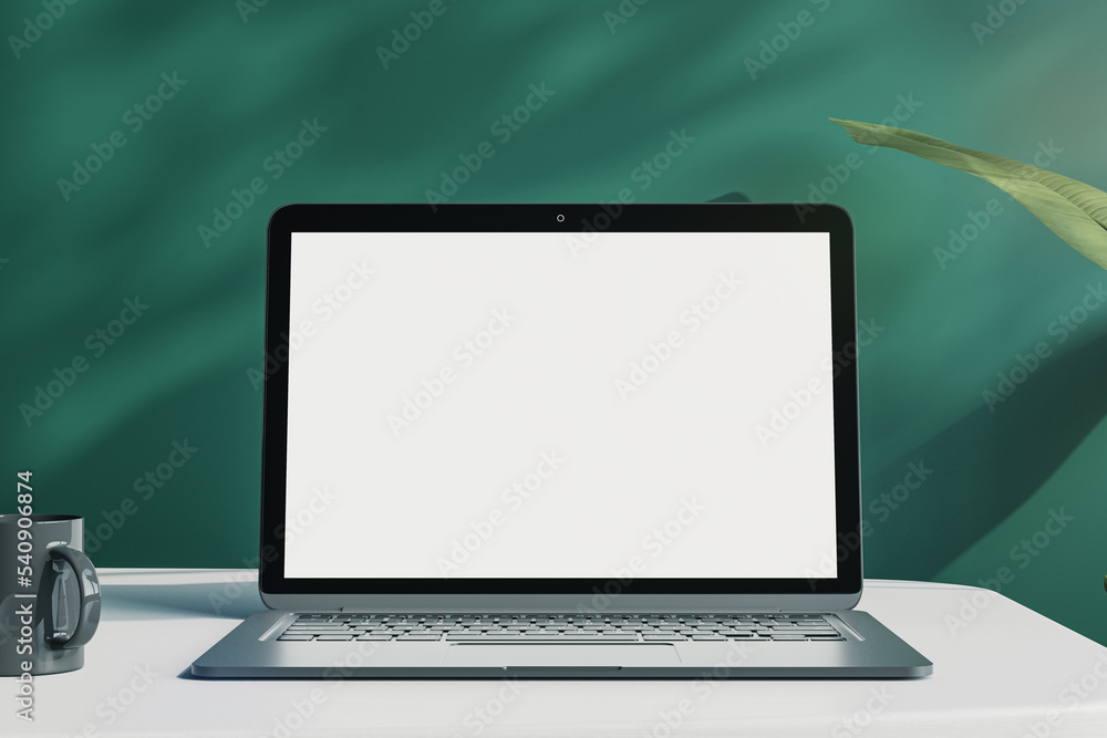 Poster office desktop with empty white laptop monitor with mock up place in frame, green wall background wi