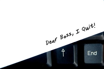 White copy space paper on keyboard background  with text written DEAR BOSS I QUIT, concept of...