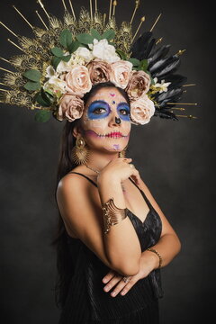 Portrait of a woman with sugar skull makeup. Halloween make-up. Portrait of Calavera Catrina