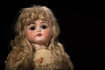 An original antique 1887 Bisque Doll handed down through three generations of family.