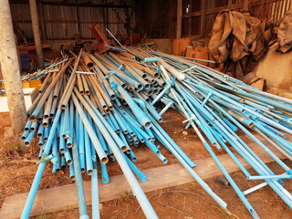 Plastic waste solution dump pile, Industrial scrap plastic on garbage shed, A lot of waste to be reused in the plastics industry, industrial waste background, plastic pipe waste.