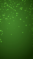 Snowy christmas background. Subtle flying snow flakes and stars on christmas green background. Delicate sweet snowy christmas. Vertical vector illustration.