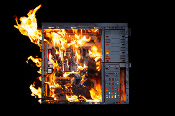 a burning system unit from a computer from a short circuit and a power surge on a black isolated...