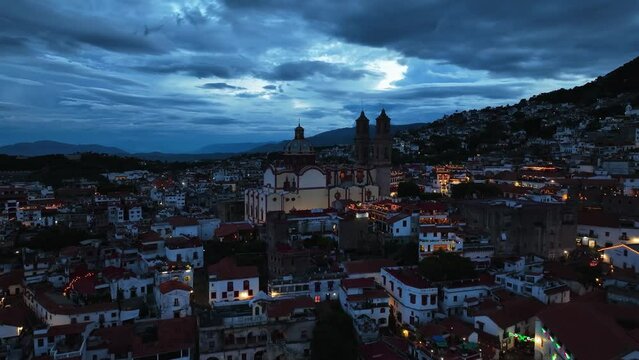 Aerial view towards the church of Santa prisca de Taxco, gloomy evening in Mexico