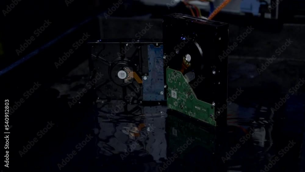 Poster external hard drive is submerged in water. concept technology and data storage.