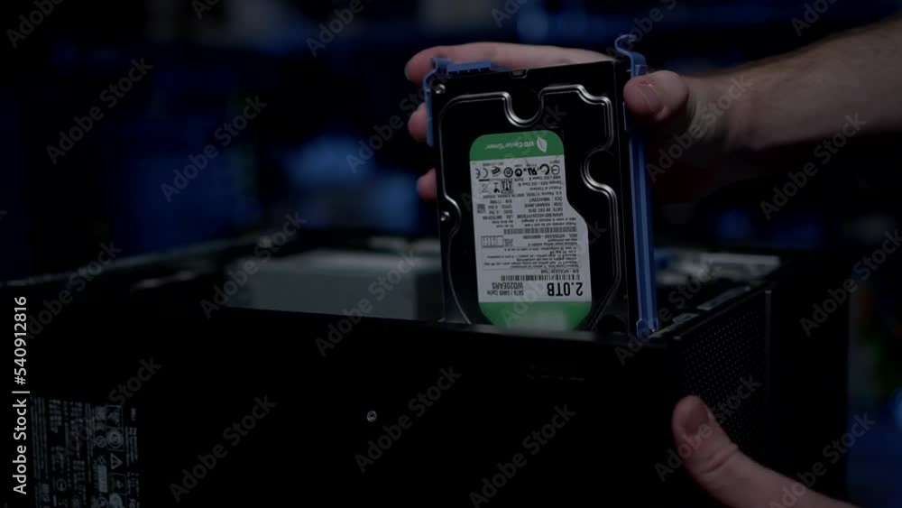 Poster hand plugged external hard drive into the cpu. concept technology data storage.