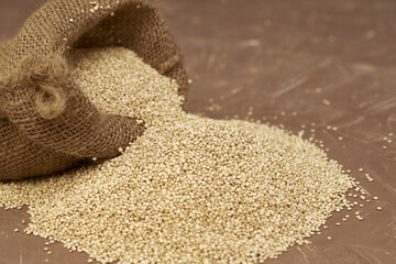 quinoa groats in a canvas bag on the table