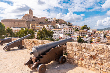 Fototapeta na wymiar Medieval cannons of the Ibiza castle wall and the cathedral in the background, Balearic Islands, Eivissa