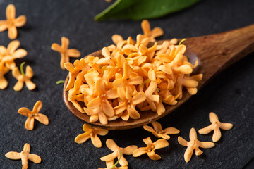 orange flowers of Sweet Osmanthus fragrans on table