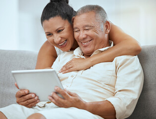 Senior couple, tablet and online in living room, social media news and ebook media app in Colombia...