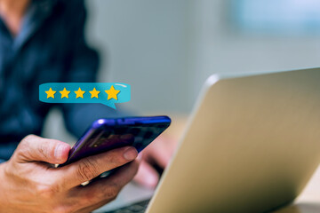 Close up client man hand using smartphone with pop up five star icon for feedback review satisfaction service, Customer service experience and business satisfaction survey, Positive feedback