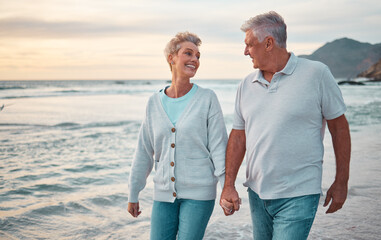 Beach, holding hands and senior couple with sunset for outdoor wellness, retirement holiday and...