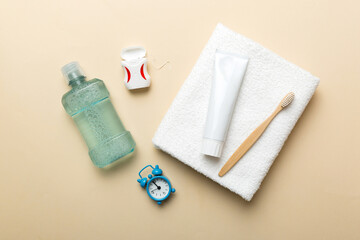 Mouthwash and other oral hygiene products on colored table top view with copy space. Flat lay. Dental hygiene. Oral care products and space for text on light background. concept