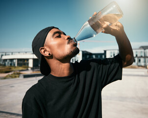 City heat, summer and black man drinking water on concrete road, thirsty gen z outdoor activity....