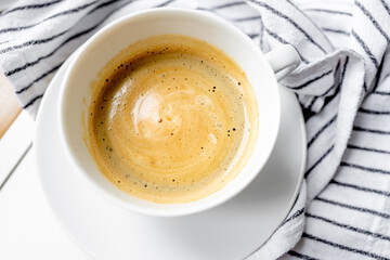 Cup of aromatic coffee on the table