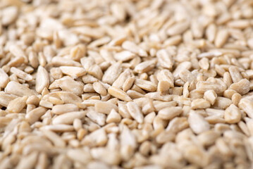 Close up shot of peeled sunflower grain. White peeled seeds of sunflower