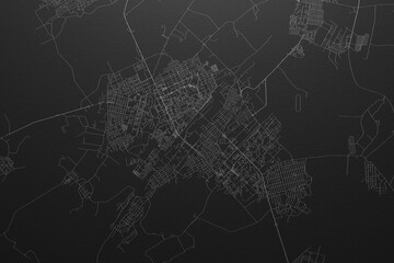 Street map of Karaganda (Kazakhstan) on black paper with light coming from top