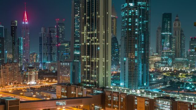 Earth Hour With Lights Turning Off And On. Towers Around Sheikh Zayed Road And DIFC District Aerial With And Without Night Illumination Timelapse In Dubai, UAE. International Financial Centre