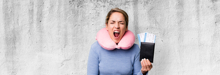 pretty blonde woman shouting aggressively, looking very angry. flight passenger concept