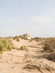 Ruin of an ancient building in the sand.