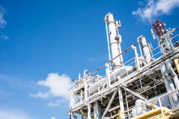 oil refinery tower on offshore platform.