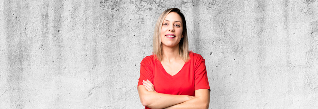 Blonde Adult Woman Looking Like A Happy, Proud And Satisfied Achiever Smiling With Arms Crossed