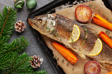 Fried carp whole. Served with lemon and roasted vegetables. Christmas decoration. Czech Traditional...