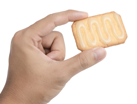Hand holding a cracker isolated