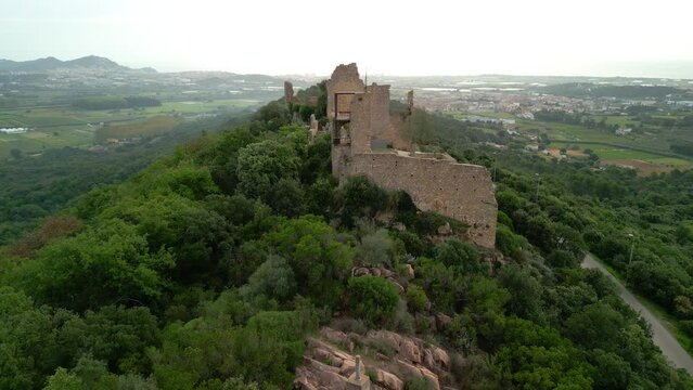 Ruined castle in Europe aerial footage cinematic medieval era  I fly in a straight line with Malgrat de Mar and Palafolls de Fondo Maresme