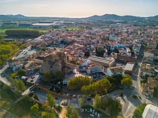 aerial images of the city of Tordera on the Costa Brava old medieval town on the side of a river