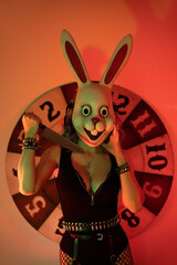Girl in bunny mask with knife.  halloween concept
