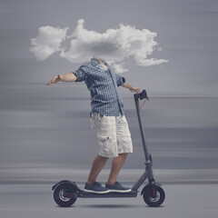 Man with head in a cloud riding a scooter