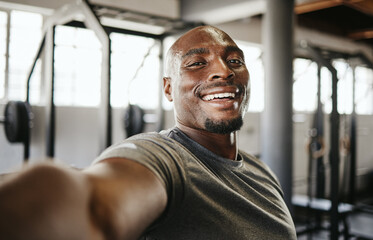 Selfie, fitness and black man training, doing a workout and cardio in the gym. Young, portrait and...