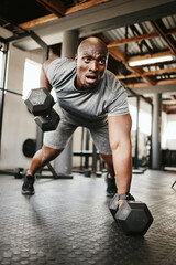 Fitness, gym and black man doing a workout with weights for strength, wellness and training....