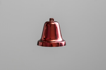 christmas red bell decoration isolated against color background