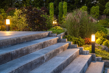 Landscaped Garden with Concrete Stairs and Decorative Illumination