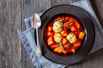 Beef Stew with Dumplings in bowl, top view