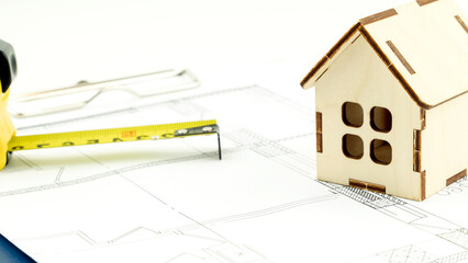 keys and the layout of the house on the drawings. the concept of buying and building housing