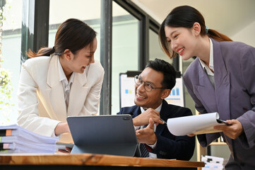 Team of professional Asian businesspeople working together in the office