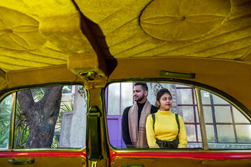 A young Indian couple shooting their pre wedding at a heritage fort in Delhi India. Romantic couple having shoot Delhi.