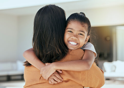 Mom, Girl And Bonding Hug In House Living Room Or Family Home In Mothers Day Celebration, Birthday Or Security. Portrait, Smile Or Happy Child With Woman Or Indonesian Parent In Trust, Safety Or Love