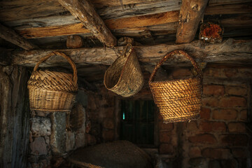 Old wicker basket, on a roof of a rustic town house in Spain, Vintage style, with old stone and wood background