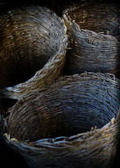 Old wicker basket, in a rustic town in Spain, Vintage style, with old stone and wood background,