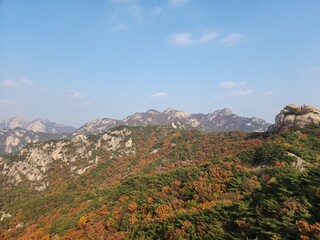 Fototapeta na wymiar Bukhansan National Park. Bukhansan Bibong Peak - Hyangnobong Peak. autumn mountains. hiking Korean mountains. mountain landscapes in autumn. trekking. rise to the top of the mountain.